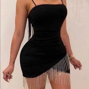 black ruched dress with sequin ends.